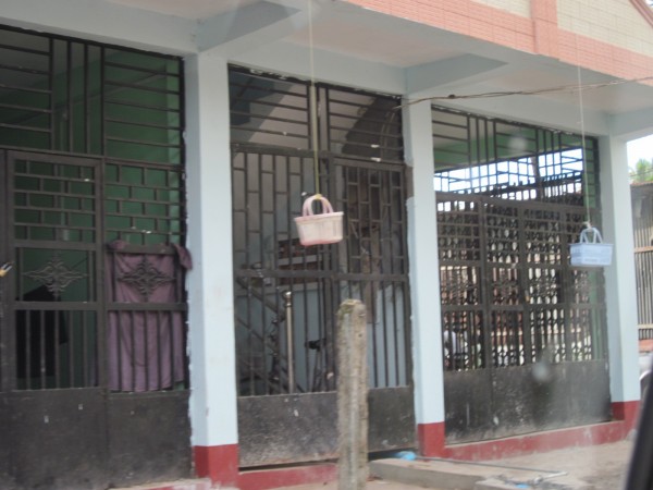 New build flats with baskets to help top floor occupants buy from street traders